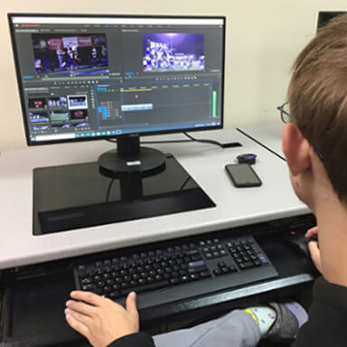 student editing a video