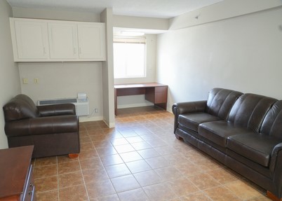 living room with desk and couch