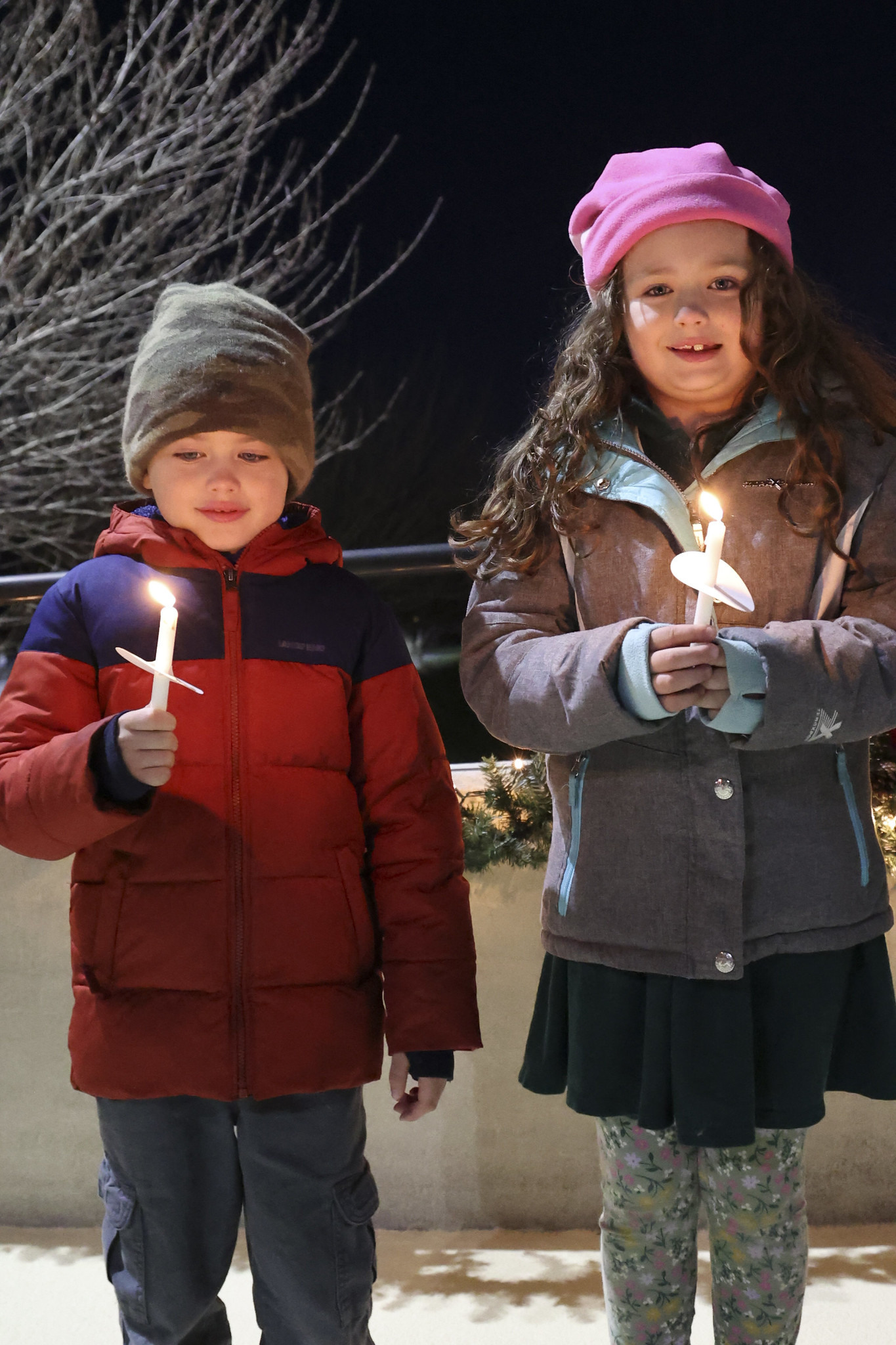 Two children holding candles