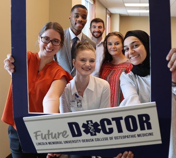 students holding future doctor sign