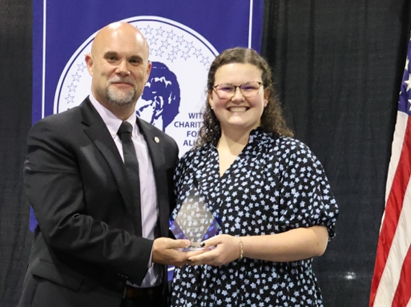 Erin Johnston receiving her award