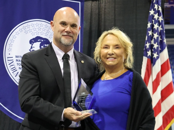 Adams receiving her award