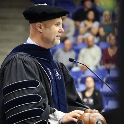 Dr. Jason McConnell speaking at graduation