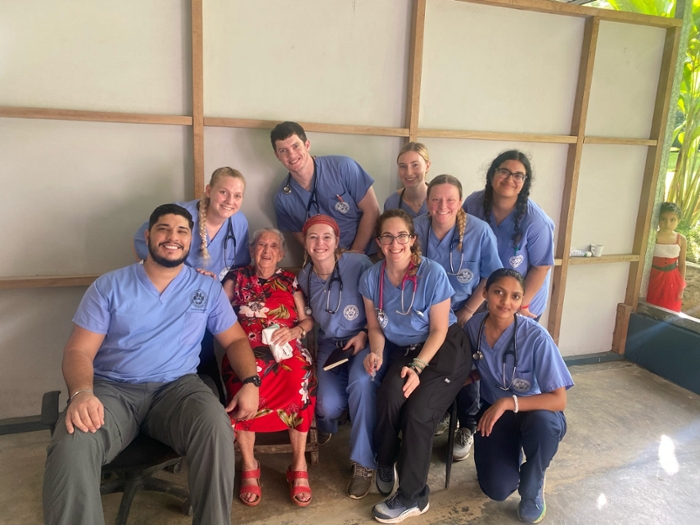 DCOM students with patient on medical mission trip to Costa Rica